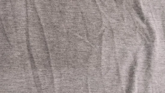 T-shirt lavorata a maglia stile melange in jersey grigio erica 95% Tc 5% elastan imitazione